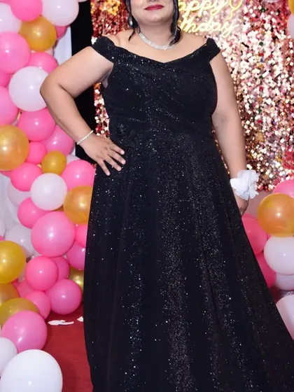 Celebrate your special events in my custom-designed outfits without breaking the budget. This black glitter off-shoulder gown is available to rent or buy.