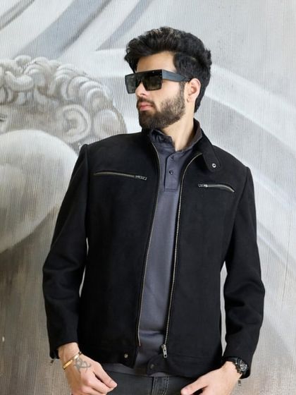 The black biker jacket, styled with sunglasses for an effortlessly cool look. It’s a versatile piece that adds a touch of edge to any wardrobe.