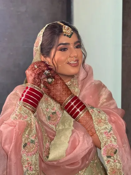 A series of shots of my beautiful bride Nam for her Lava wedding. She wore a lovely pastel pink and green suit, and we created a soft glam look with wavy hair that felt modern yet traditional.