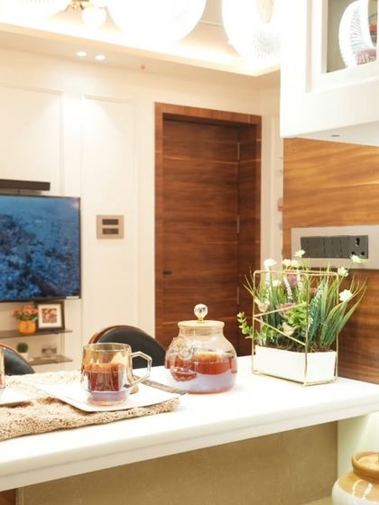 A close-up of the breakfast counter, styled to show how it can be used for morning tea or as an extra prep surface, seamlessly connecting the kitchen and living spaces.