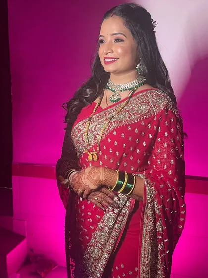 The complete look, with the bride glowing under the party lights.