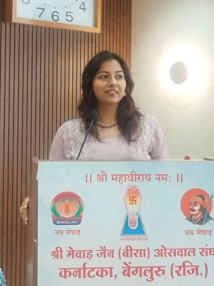 Another shot of me at the podium during the community oath-taking ceremony. My command of Hindi and my ability to connect emotionally with the audience were particularly appreciated here.