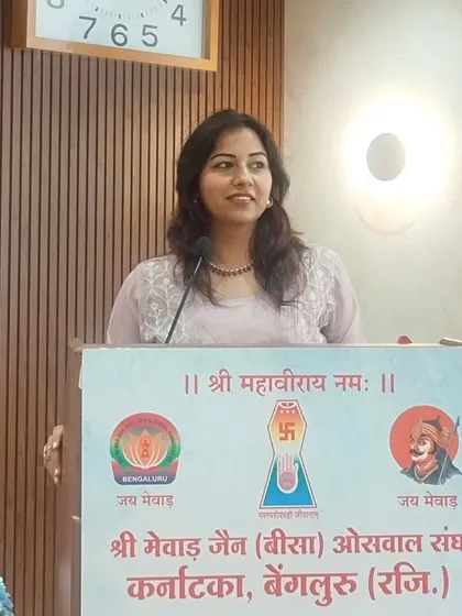 Another shot of me at the podium during the community oath-taking ceremony. My command of Hindi and my ability to connect emotionally with the audience were particularly appreciated here.
