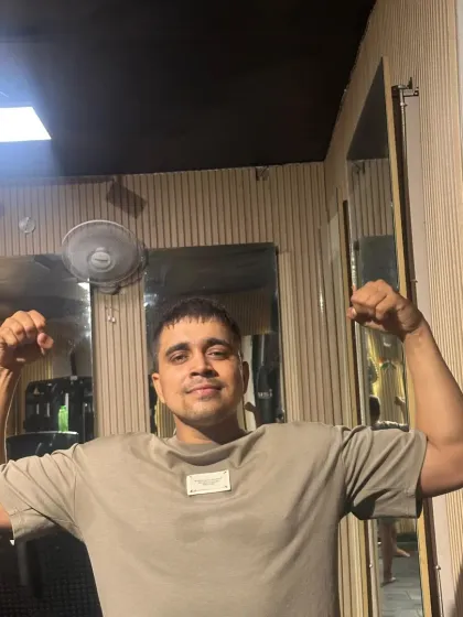 Flexing to show the results of my own training. I lead by example.