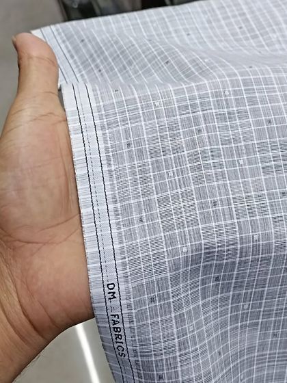 This is a high-quality kurta fabric with a grey checkered pattern. It is a comfortable and breathable material, perfect for everyday wear.