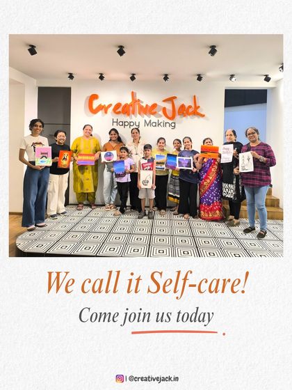 A group of participants of all ages proudly holds up their artwork at my Thane studio. I call it self-care, and I invite everyone to come join us.