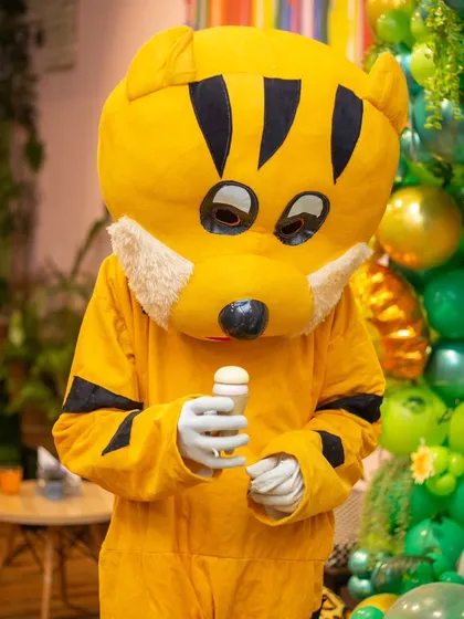 Even tigers need a break! Our friendly mascot enjoying a quiet moment during the party.