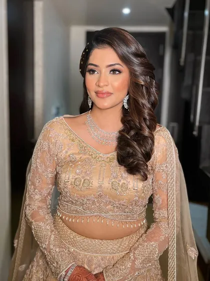 Krisha looking confident and beautiful, with makeup that enhances her features perfectly for an evening event.