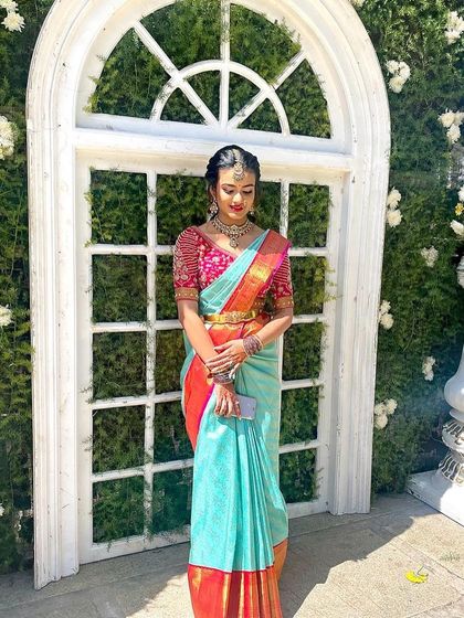 A candid shot showing the full traditional attire. The makeup and hair are designed to last throughout the day's festivities.