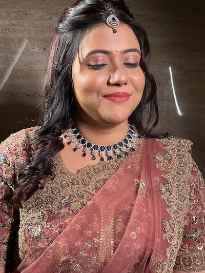 A close-up of the soft pink eye makeup and matching lip.