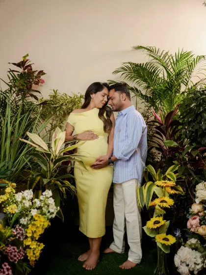 For clients who want a touch of nature indoors, we can create a lush garden setting right in the studio. Here, the couple is surrounded by greenery, creating a vibrant, life-filled portrait that celebrates new beginnings.