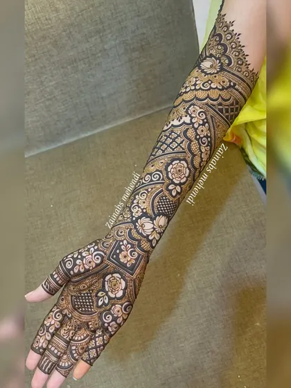 A complete view of Zeba's bridal arm, showing how the pattern flows from the palm to the elbow in a stunning, cohesive design.