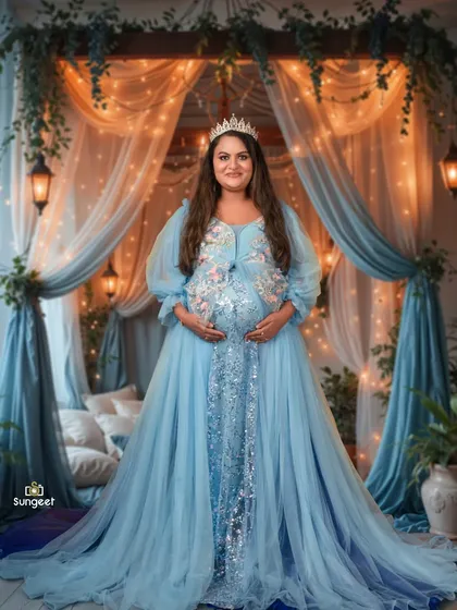 Feel like a princess in our dreamy, fairytale-themed setup. This mom-to-be is wearing one of our beautiful blue gowns, complete with a tiara, against a backdrop of soft curtains and fairy lights.