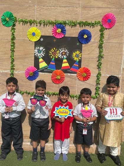 Young students pose with fun props during the Diwali celebrations at school. We ensure that our festive events are filled with joy, laughter, and memorable moments.