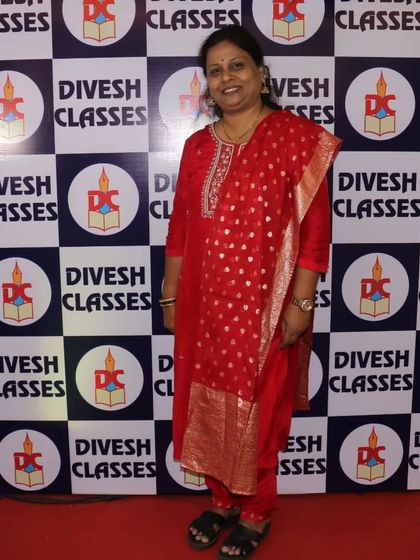 Mrs. Parab, a key pillar of our institution, gracing the farewell occasion in a beautiful red traditional outfit.