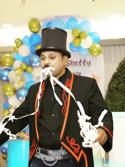 Performing the paper stream illusion at a birthday party. It's a visual and hilarious trick that fills the stage with color and fun.