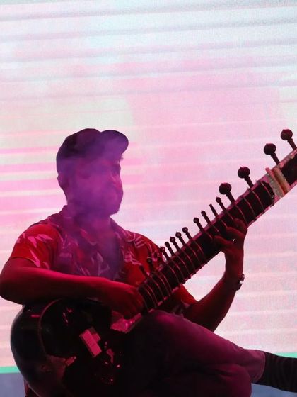 An artistic shot from a fusion gig with colorful, hazy lighting. This captures the modern, dreamlike quality of my experimental music.