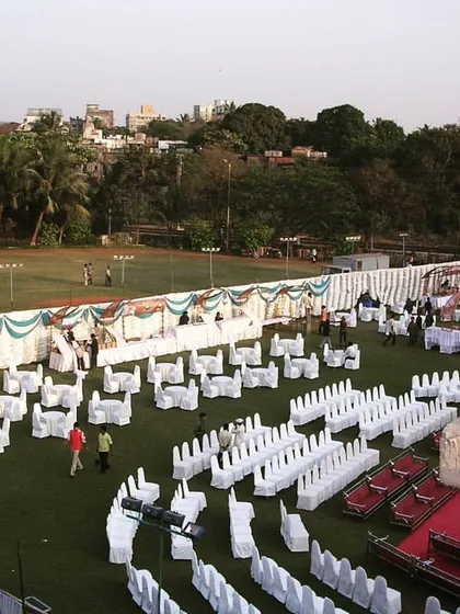 This high angle view shows a complete event layout on a large ground. I can organize different zones for seating, dining, and stage areas to make the best use of any open space.