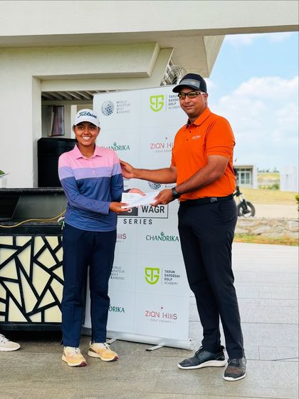 A female champion is recognized for her performance. We are proud to develop top talent across all categories.