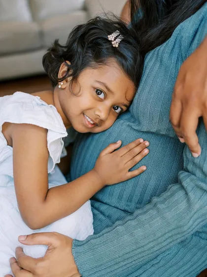 Moments like this are pure magic. A big sister-to-be listening for her new sibling. Including older children in maternity sessions makes the story complete and helps them feel part of the exciting journey ahead.