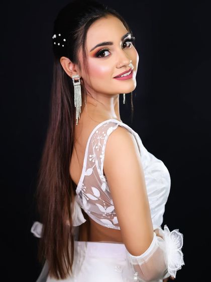 A smiling portrait that shows how this look enhances the model's natural beauty.