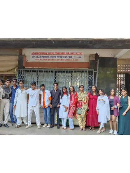 A group of students and a teacher outside our Orlem branch, all dressed up for the Bollywood Day celebration.