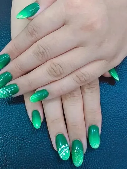 Another angle showcasing the student's skill in creating a balanced and attractive full set of designed nails.
