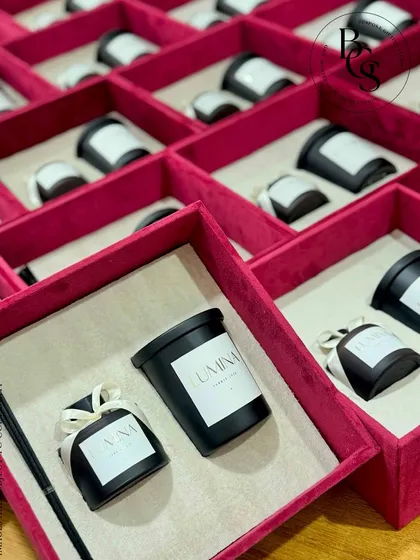 Another view of the 'LUMINA' invite hampers, highlighting the custom-branded candles and diffusers. This demonstrates my ability to source and personalize products to fit a specific event theme.