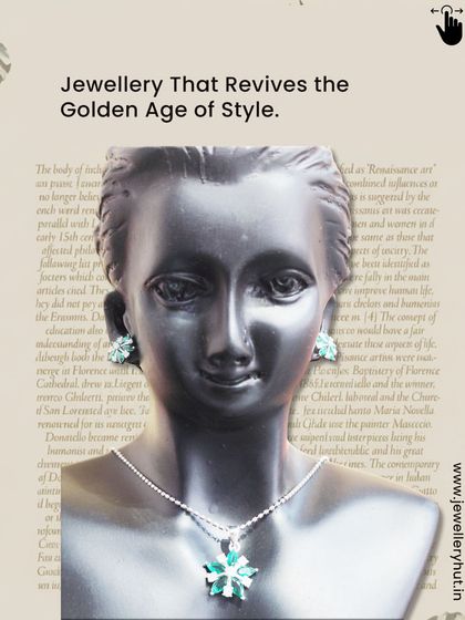 A beautiful green floral pendant and earring set, inspired by the golden age of style.