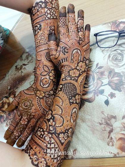 A non bridal design with a creative pose, showing the full length of the intricate patterns.