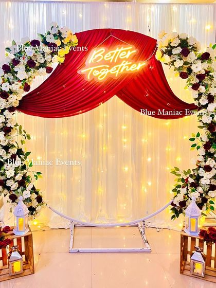 The engagement backdrop without the cake table, showing the full circular frame and the beautiful draping. This is a versatile setup for Roka, anniversaries, or photo booths.