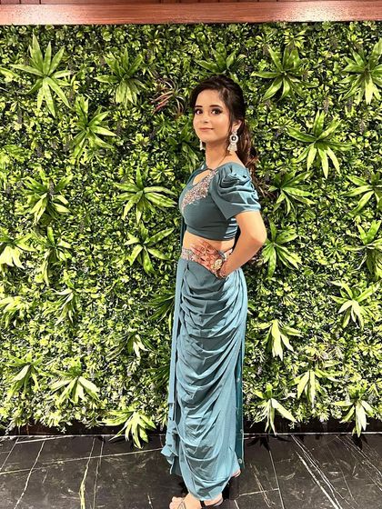 Another angle of this stylish Indo-Western set, perfect for a cocktail party or a wedding reception. The draped skirt is easy to move in, while the embellished top adds just the right amount of sparkle.