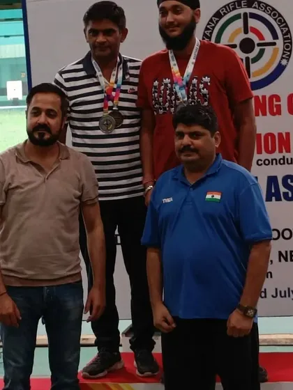 My role often extends to officiating. In this photo, I am presenting medals to the winners at a Haryana State Rifle Association championship, a testament to my recognized expertise in the shooting community.