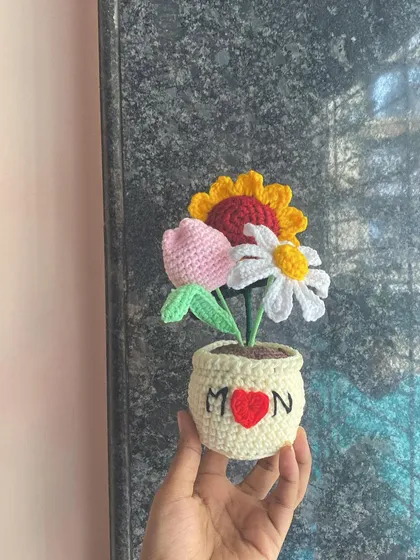 I love making custom gifts that tell a story. This special arrangement with a sunflower, tulip, and daisy was made for a lovely customer to gift their mom. I can personalize the pot with names or messages to make your gift extra special.