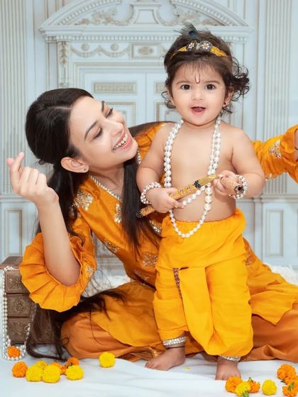 A mother and her little Krishna share a sweet moment. Our Janmashtami sessions are a wonderful way to celebrate with your child.