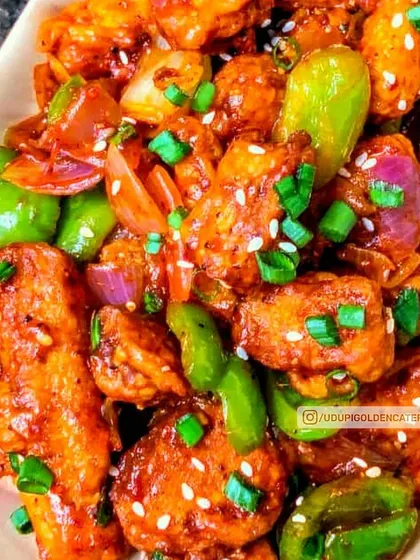 A close-up of our delicious Gobi Manchurian, tossed in a savory and tangy sauce with fresh bell peppers and onions. This popular Indo-Chinese dish is prepared live, ensuring every bite is hot, crisp, and full of flavor.