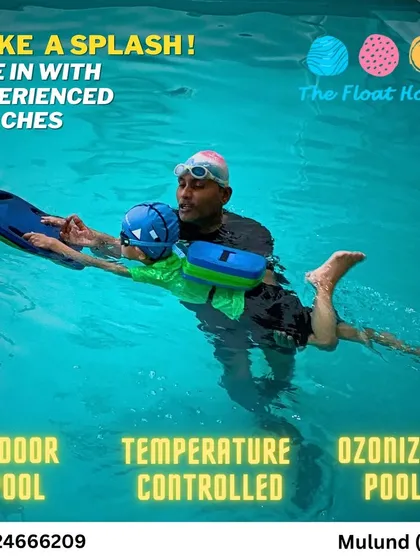 Our experienced coaches are passionate about teaching. Here you can see one of our instructors providing one-on-one guidance, ensuring every child learns to float and swim with confidence.