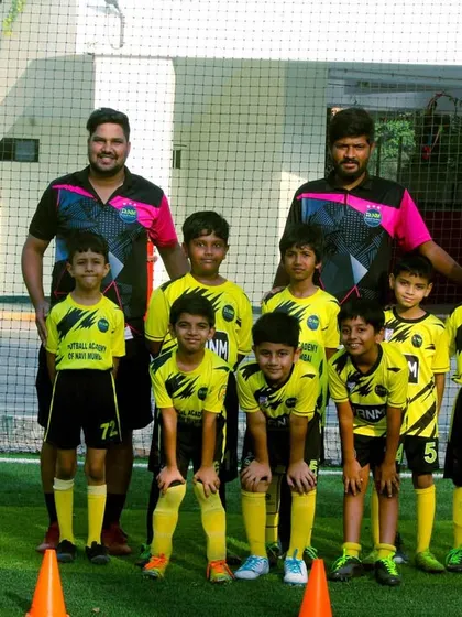 Another batch of our young players posing with their coaches after a productive training session.