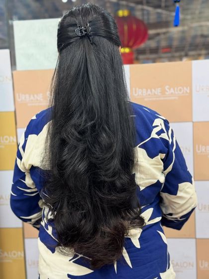 A simple half-up style is a great way to show off the layers and length of this beautiful haircut.