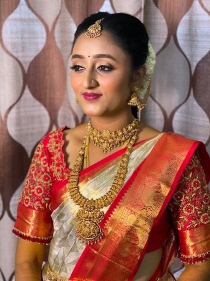 Another beautiful shot of Vidya's Muhurtham look. The lighting catches the subtle glow on her skin, a signature of my HD makeup application.