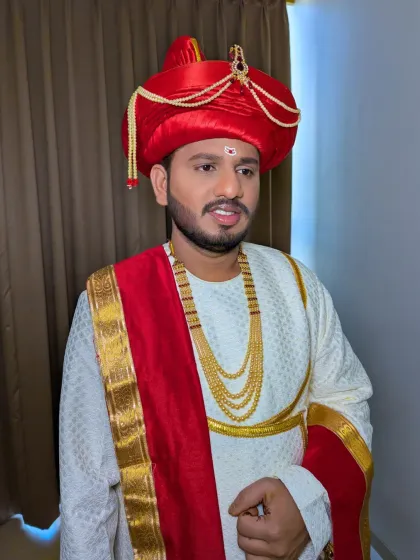 Another angle of the traditional Maharashtrian groom. The hairstyle is kept neat to perfectly balance the elaborate turban, or 'pheta'.