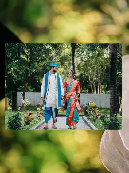 Walking together through a lush green path. This shot, framed by foliage, creates a sense of a private, romantic journey.