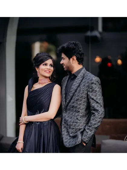 This is a perfect example of a modern, chic look for a reception or cocktail party. I gave the bride a sophisticated makeup look with a defined eye and a soft lip color to match her elegant navy gown, creating a polished and contemporary couple's portrait.