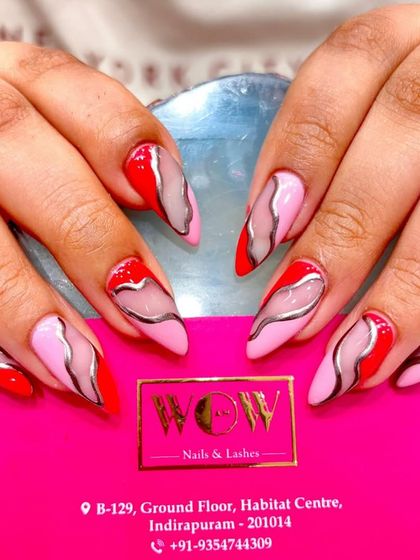 A bold and artistic design featuring a mix of red and pink with abstract chrome silver lines. This look is modern, edgy, and incredibly stylish.