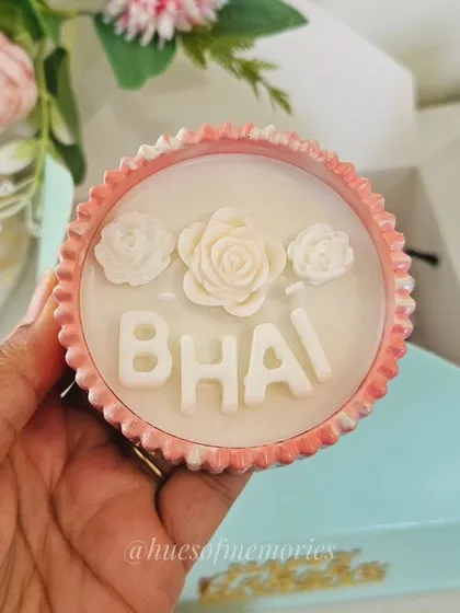 I create personalized candles for every occasion. This one was for Rakshabandhan, with "BHAI" spelled out in wax letters. You can customize the vessel shape, color, and fragrance to make your gift truly special.
