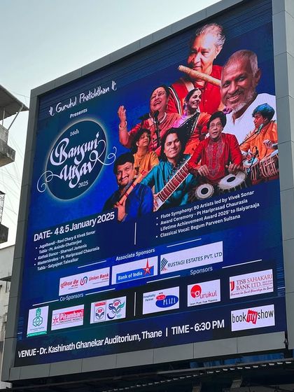 A close-up of the large billboard for the 16th Bansuri Utsav in Thane.