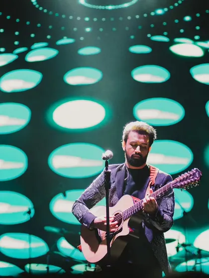 Atif Aslam against a stunning graphic backdrop. Our entertainment design goes beyond just booking an artist; we create a complete visual and auditory experience.