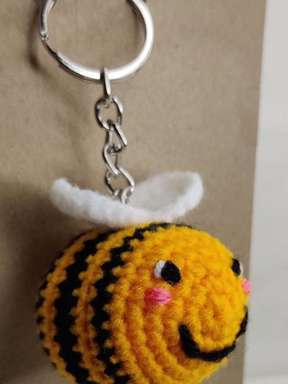 My super popular bumblebee keychains. They come in the classic yellow and black, but I also make them in fun colors like pink, blue, and purple.