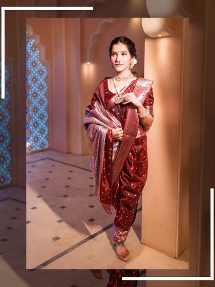 A walking shot of the model in the Navari saree, capturing the grace and movement of the outfit.