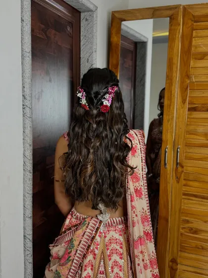 Another angle of the floral braided hairstyle, showing how it adds a touch of nature and romance.